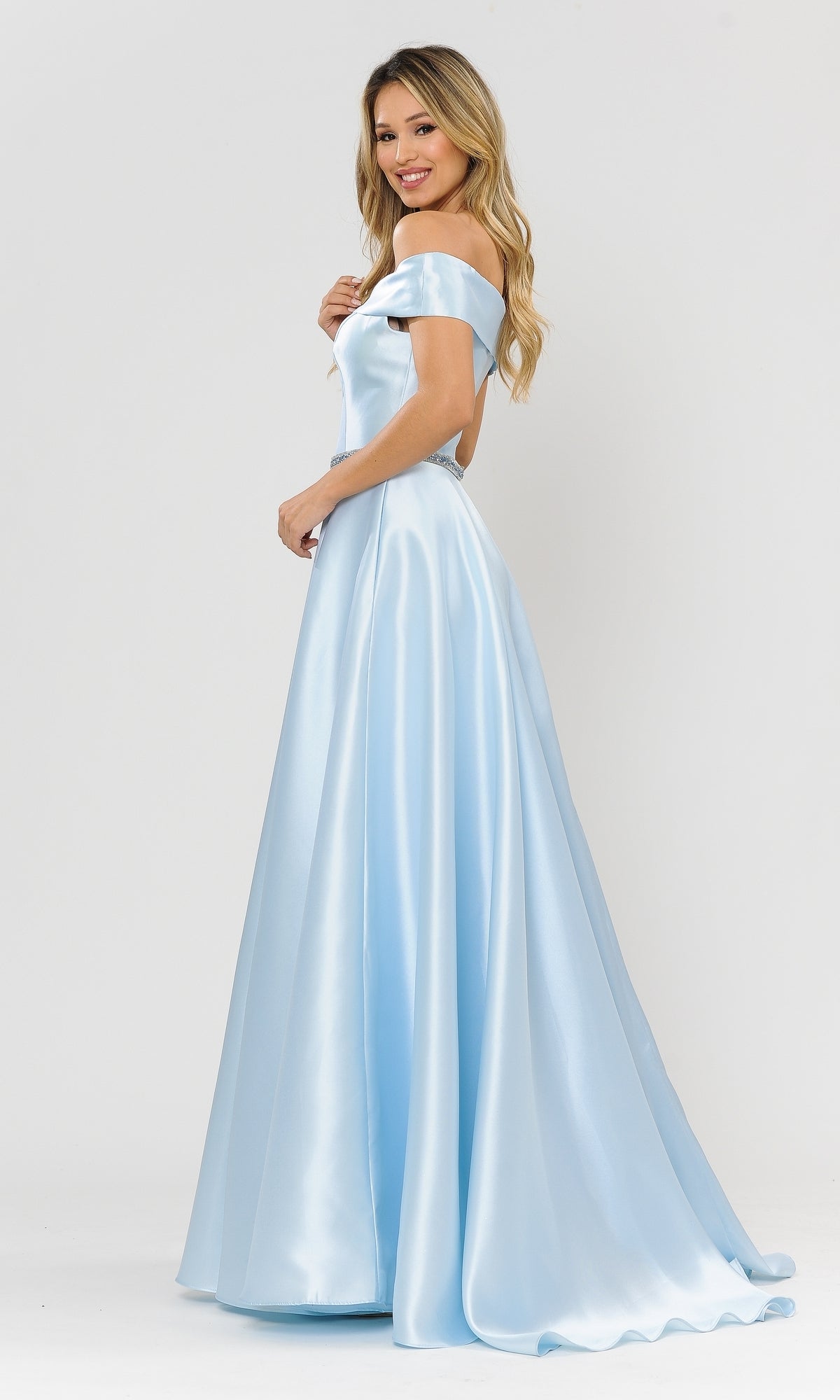 A woman smiles in the Plunging V-Neck Long Mikado Prom Ball Gown 8680, a light blue off-the-shoulder dress, as she stands against a plain white background.